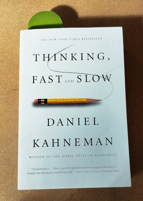 Thinking fast and slow book by Kahneman on my desk